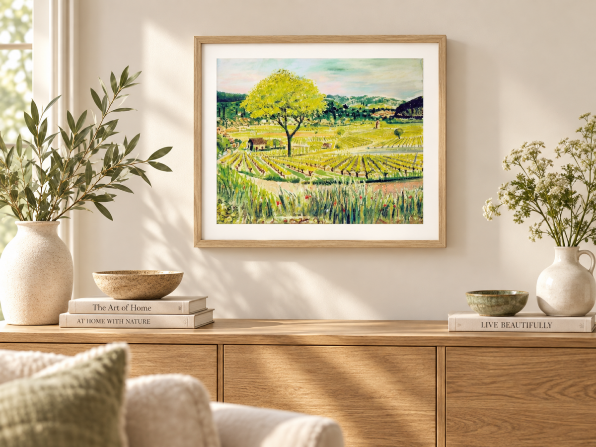 Framed Provence vineyard landscape print by Susan Horsfield featuring a yellow-green tree, patterned fields and distant hills.